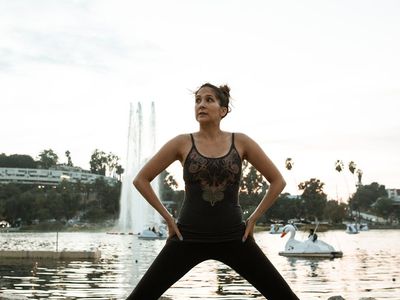 Silhouette of a person doing a stretching exercise.